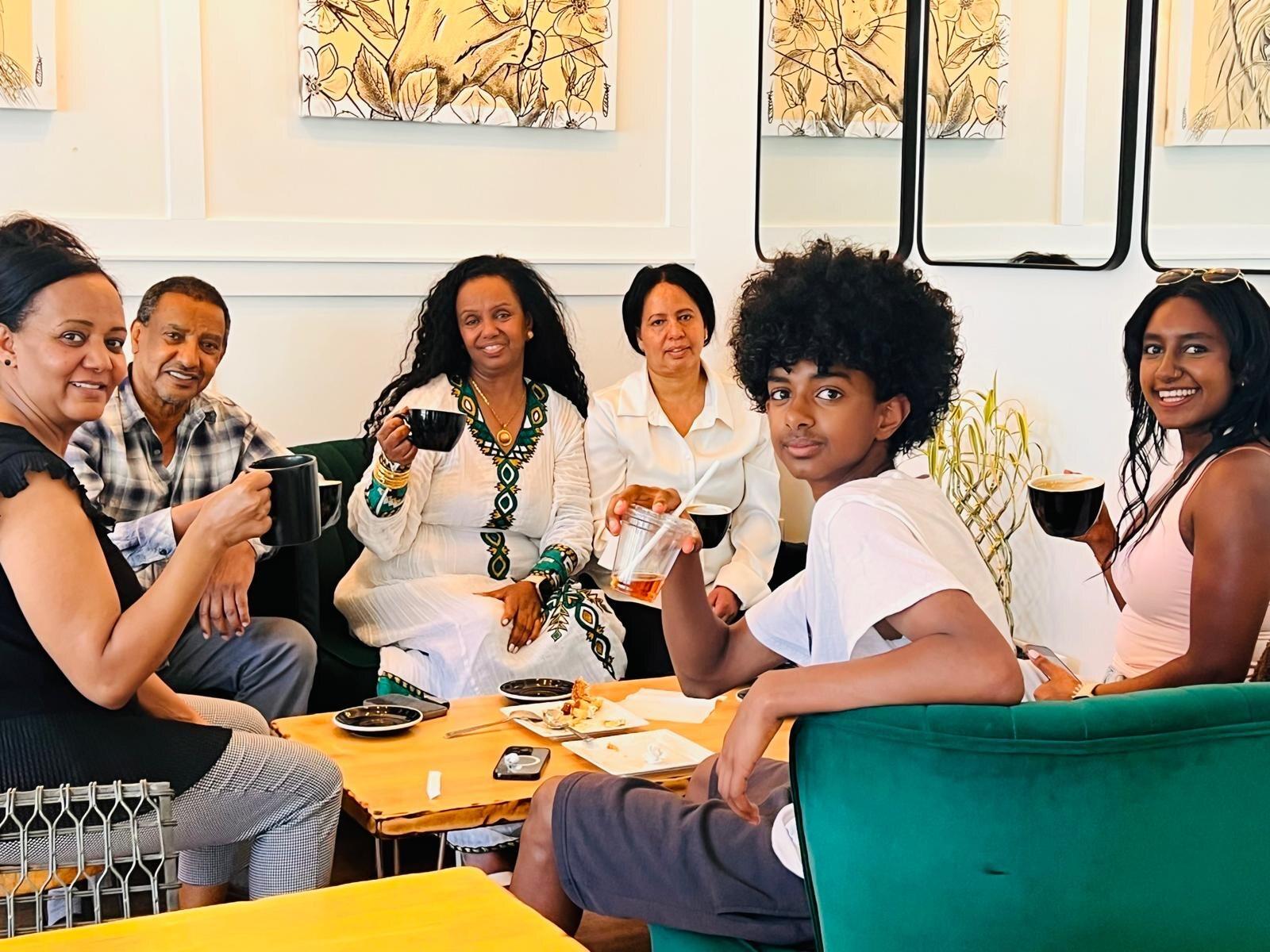 Guests sharing coffee together in the Isaiah Café lounge
