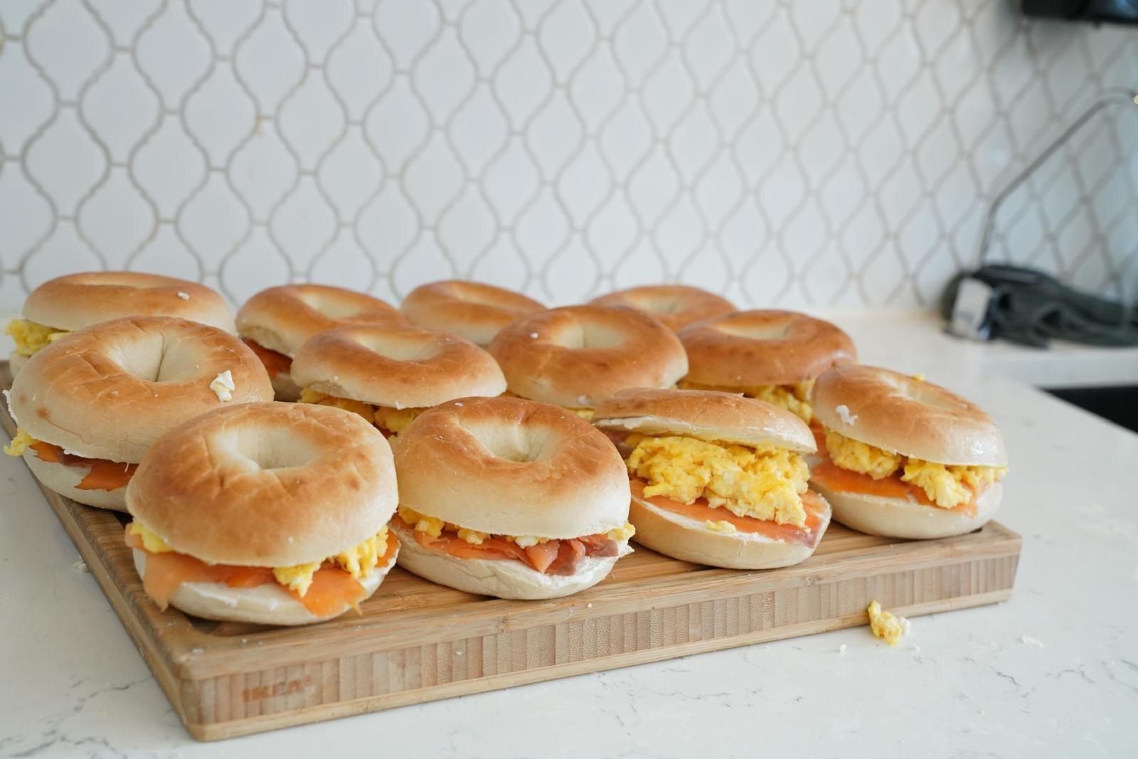 A board of breakfast bagel sandwiches prepared for catering