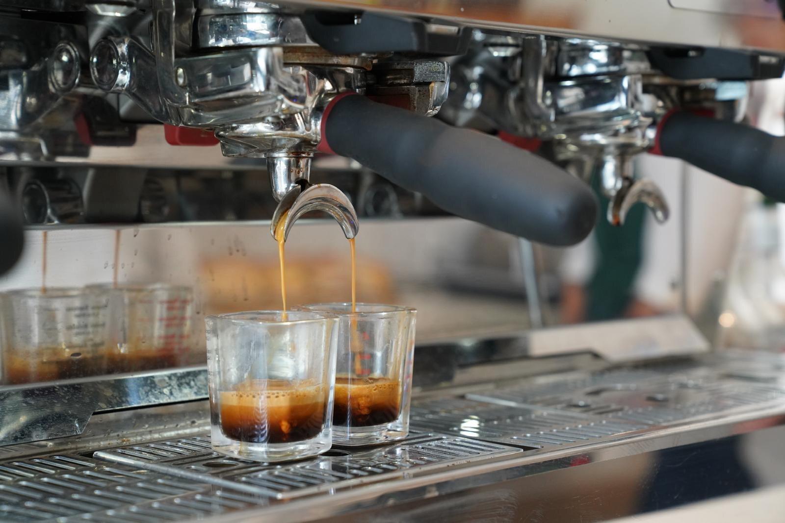 Espresso pulling into shot glasses at Isaiah Café